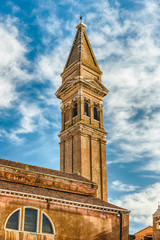 The leaning belltower of St Martin Church, Burano, Venice, Italy