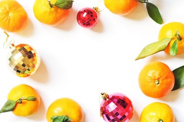 Flat lay Christmas mockup and New Year banner. Mandarins and red, yellow decorative balls on a white background