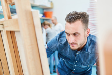 Fototapeta premium Painter learns in the studio of an art college
