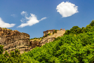 Fototapeta na wymiar Scenic view of Meteora Valley with rock formations and the Holy Monastery of Varlaam, part of the Eastern Orthodox monastery complex of Meteora, Central Greece