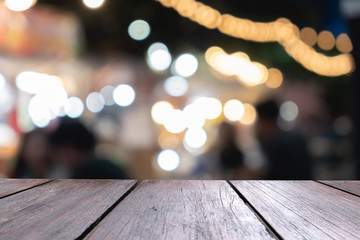 Empty wooden table of brown in front blurred background, can be use to advertising template and presentation your product