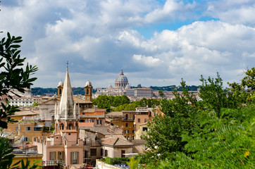 Fototapeta na wymiar Looking over Rome towards St Peter's Basilica with spire in foreground