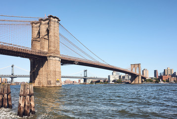Brooklyn Bridge and East River on a sunny day, New York City, USA.