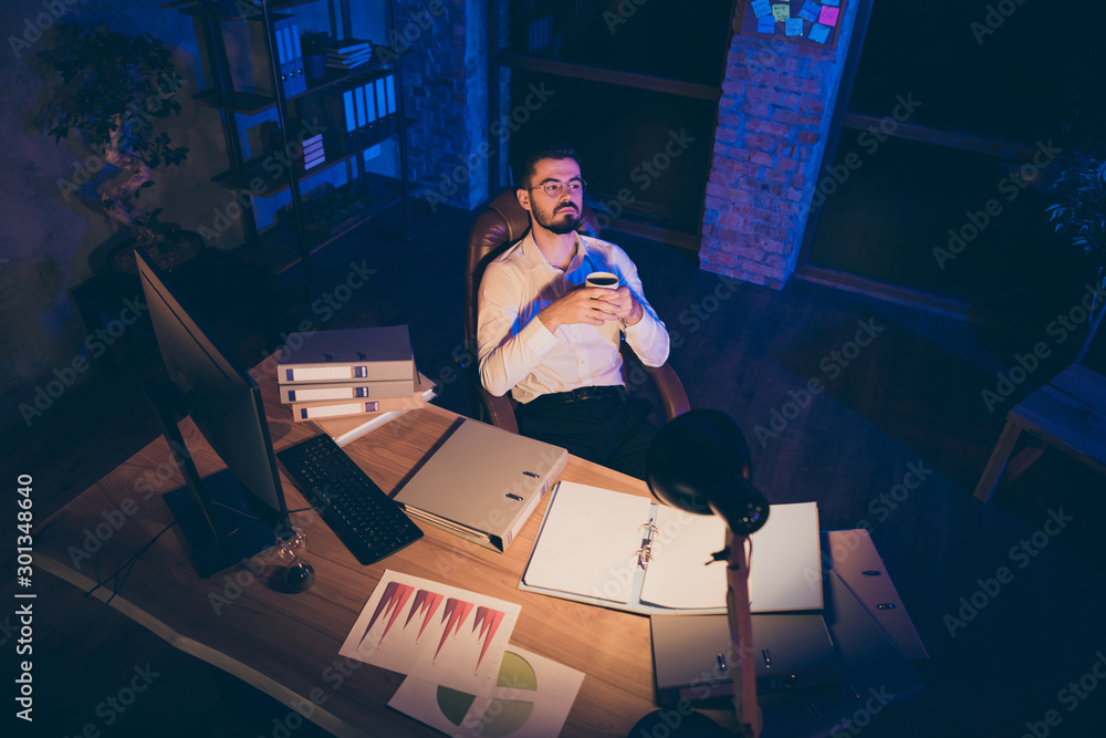 Poster top above high angle view photo of pensive thoughtful dreamy man looking pensively after having done