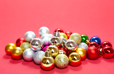 Colorful christmas balls collection on red background