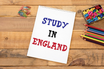 Text Study in England handwritten on notebook