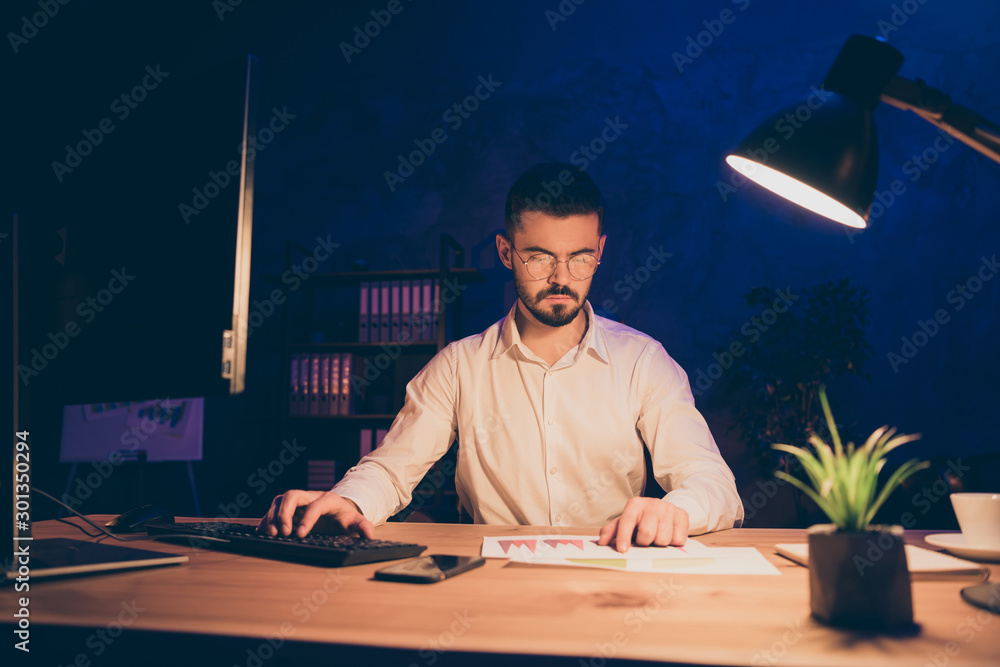 Poster photo of serious pensive pondering man analyzing information received from graphs and comparing it w