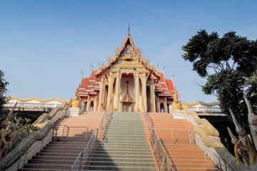 view of buddhist temple with blue sky background, Wat Hua Pong, Ban Pong, Ratchaburi, Thailand.
