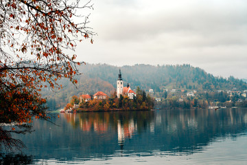 Autumn landscape with lake Bled and church in Slovenia