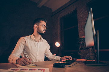 Low below angle view photo of pensive pondering thoughtful executive comparing written results of...
