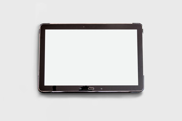 Black digital tablet on white background. mock up top view