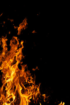 Yellow flames licking the frame against a black night background