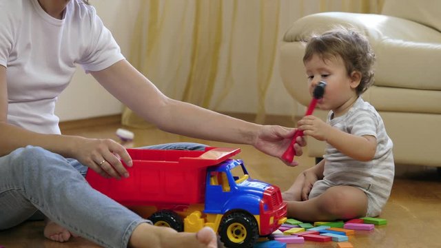 Mother and child playing in the room.