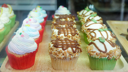 Fancy cupcakes display in cafe