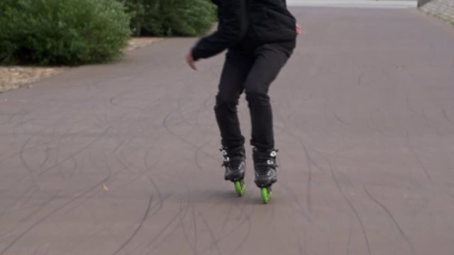 Inline Skater jumps to skate backwards