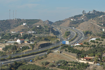 Highway with cars circulating in Torrox a sunny day, Spain