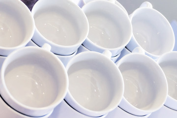 Empty White Cups Stacked on the Table. Tea or Coffee Catering Services at the Hotel, Event, Conference, Business meeting or Wedding. Top View.