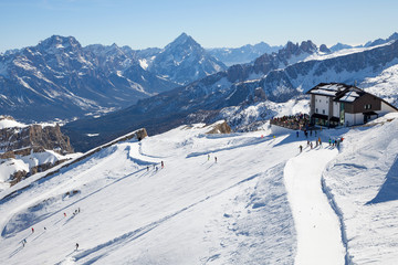 Fototapeta na wymiar Dolomites, Italy - view from mountain Lagazuoi, nearby Cortina d'Ampezzo in the Veneto Region. Mountain skiing and snowboarding.