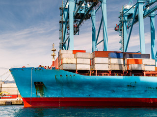 Container ship in the habor loading and unloading containers