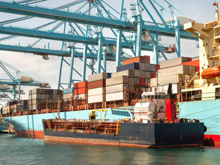 Container ship in the habour loading and unloading containers