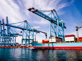 Container ship in the habour loading and unloading containers