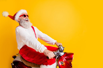 Profile photo of stylish santa white hair grandpa rushing x-mas theme party by retro bike wear...