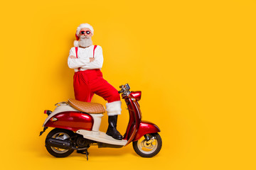 Full length photo of santa arrogant man standing self-confident near retro moped bike crossed arms...