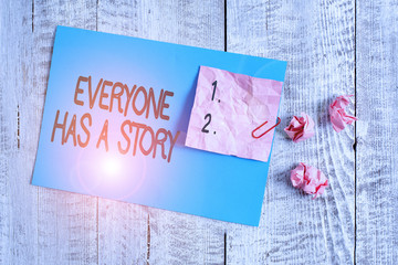 Word writing text Everyone Has A Story. Business photo showcasing Background storytelling telling your memories tales Wrinkle paper and cardboard plus stationary placed above wooden background