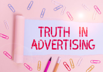 Writing note showing Truth In Advertising. Business concept for Practice Honest Advertisement Publicity Propaganda Stationary and torn cardboard placed above plain pastel table backdrop