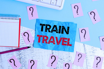 Handwriting text writing Train Travel. Conceptual photo to make a journey a long distance by using rail transit Writing tools, computer stuff and math book sheet on top of wooden table