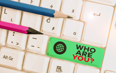 Writing note showing Who Are You Question. Business concept for Identify yourself description...