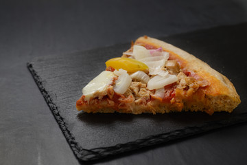 pizza slice with tuna and onion, pepperoni, egg, and frankfurter, served 