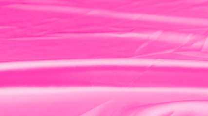 Plastic pink satin fabric texture soft blur background