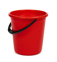 empty red plastic household bucket on a white background - obrazy, fototapety, plakaty