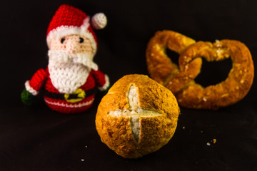 typical Bavarian bretztel on a background of Santa Claus