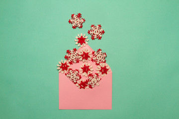 Gold decorative snowflake fly out of the cover on a neo mint background. Pastel colors for a...