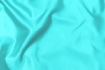 Cyan-Teal satin fabric texture soft blur background