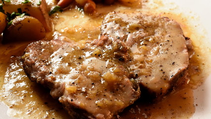 Grilled Steak Ribeye with french fries,Slicing tasty grilled meat with vegetable