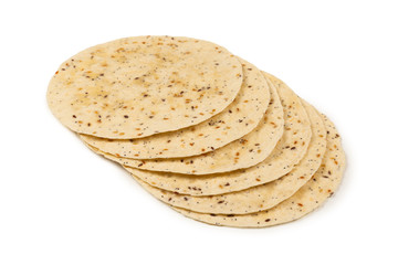 Pitta bread with seeds isolated on white