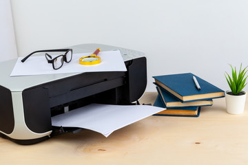 Office printer close up on a wooden table