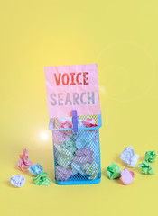 Handwriting text writing Voice Search. Conceptual photo allows the user to use a voice comanalysisd to search the Internet Trash bin crumpled paper clothespin empty reminder office supplies yellow