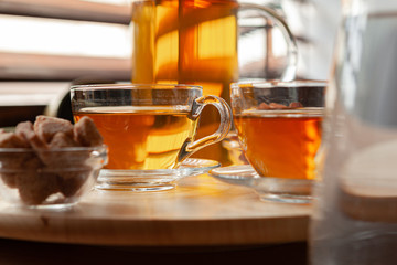 Hot refreshing citrus tea in glass close up
