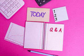 Text sign showing Q And A. Business photo showcasing a period of time or an occasion when someone answers questions Writing equipments and computer stuffs placed above classic wooden table