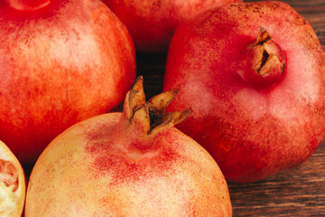 Group of pomegranate fruits close up background