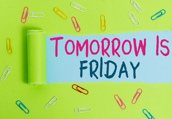 Writing note showing Tomorrow Is Friday. Business concept for Weekend Happy holiday taking rest Vacation New week Paper clip and torn cardboard on wood classic table backdrop