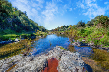 Beautiful spring landscape with river and blue sky in South of Spain.