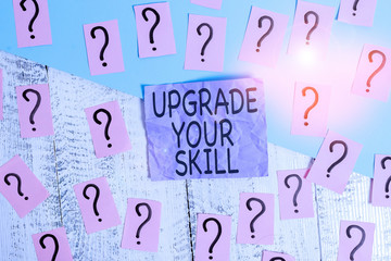 Text sign showing Upgrade Your Skill. Business photo showcasing Expand Scope of Knowledge Optimize Skills Craft Scribbled and crumbling papers with thick cardboard above wooden table
