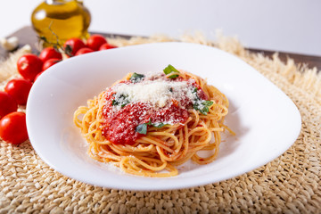 Spaghetti with tomato sauce and grana padano cheese. Classic dish of Italian tradition. Healthy eating, italian food