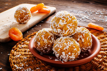 Protein balls with apricots and coconuts Apricot Energy balls, selective focus