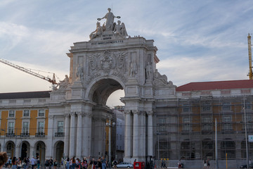 Fototapeta na wymiar Lisbon, Portugal, November 20, 2019: Commerce Square or Terreiro, near the Tagus River, a majestic arched building with large columns, rich in details, located in the city of Lisbon.